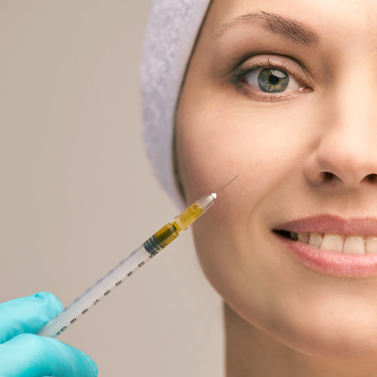 vampire facial needle in front of patient